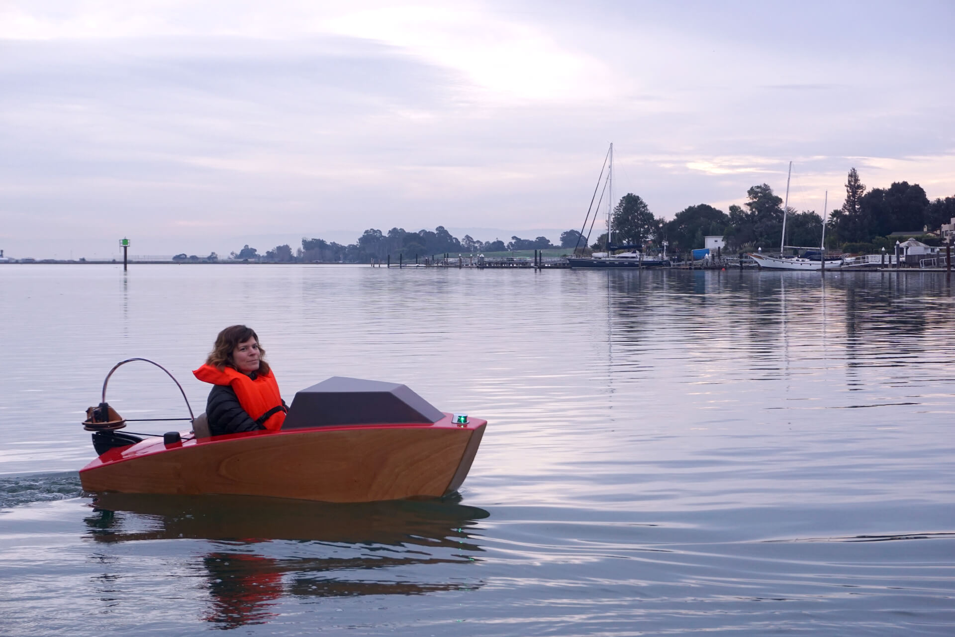 Erika at the first launch of the mini electric boat, turning around