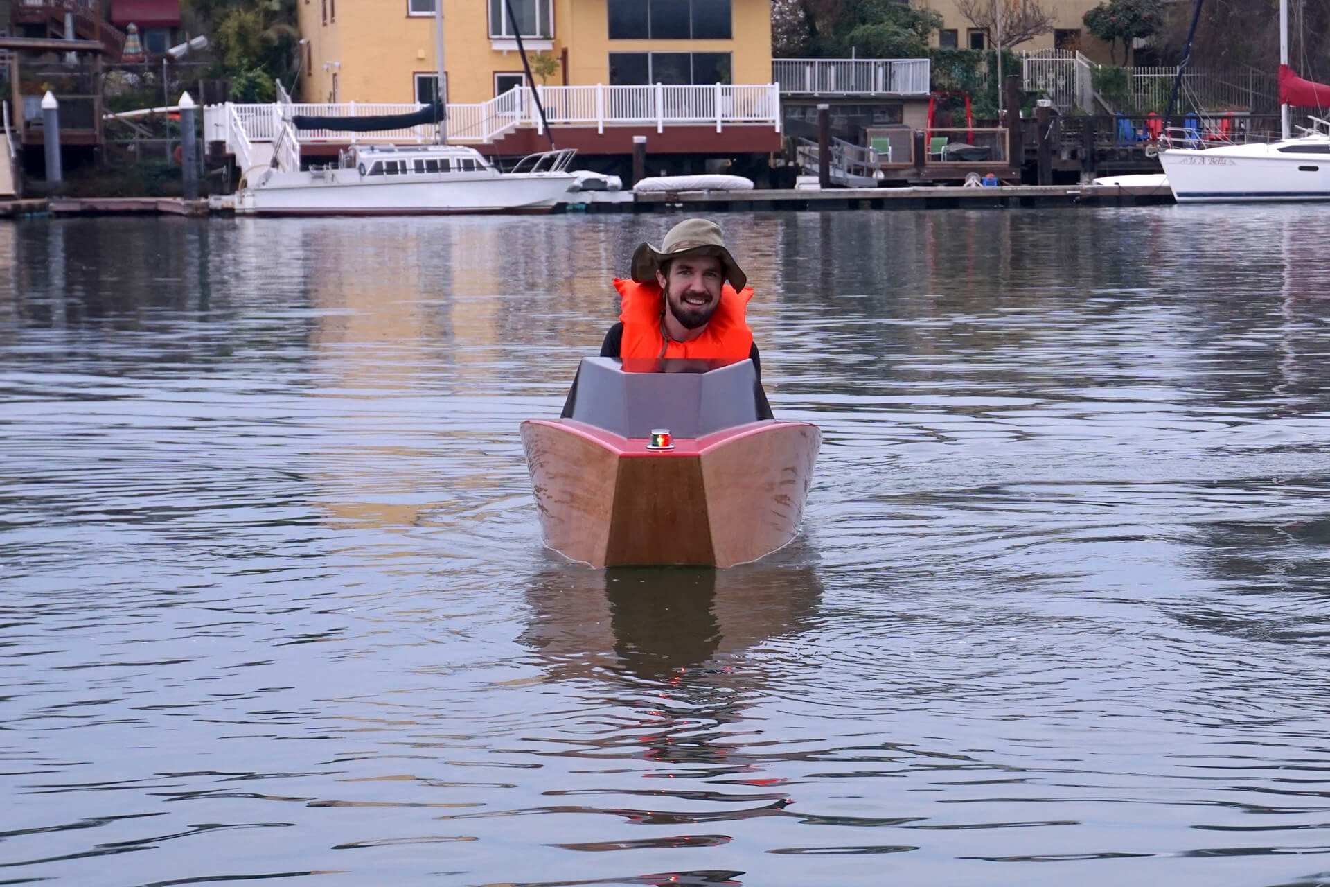 Josh racing towards the camera at the first launch of the mini electric boat