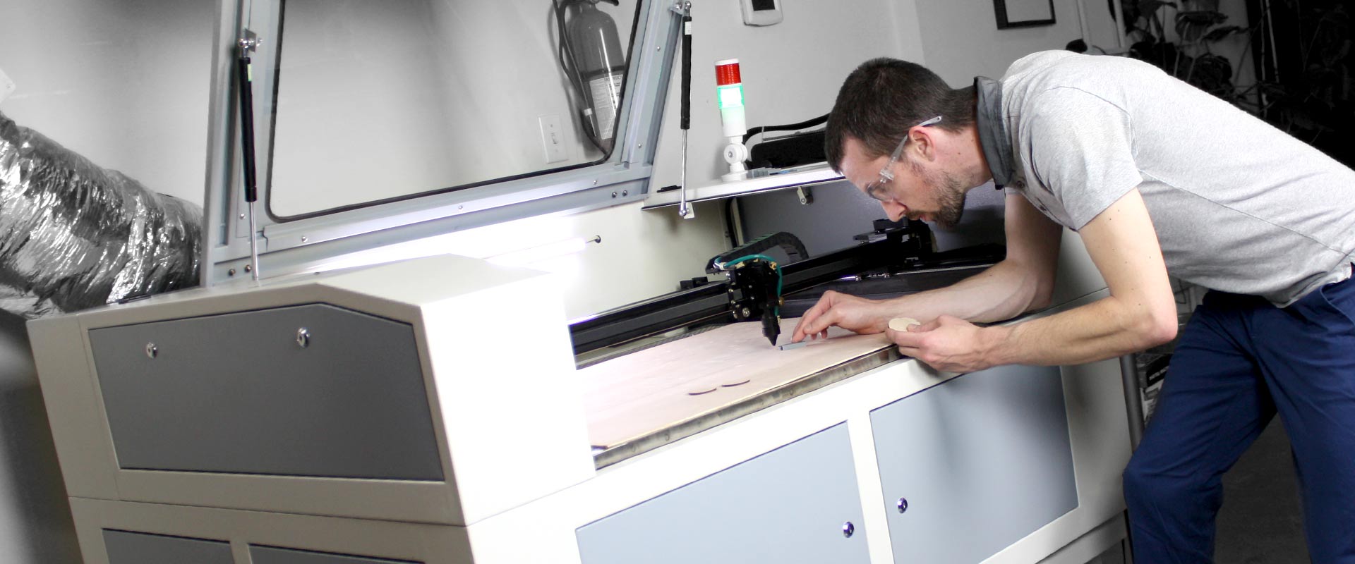 Josh dialing in the laser cutting machine