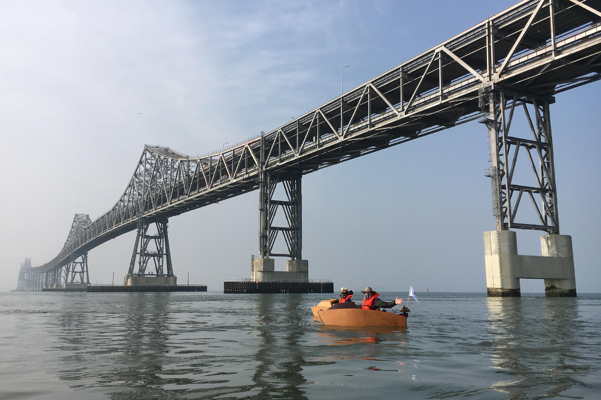 Two mini boats under the Richmond bridge