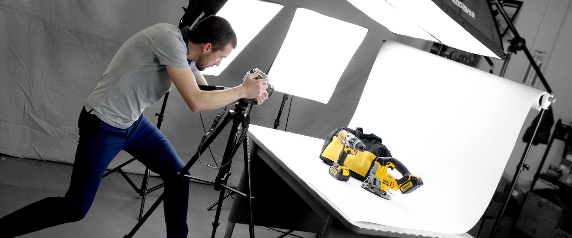 Josh shooting a Dewalt power-drill set on white-seamless